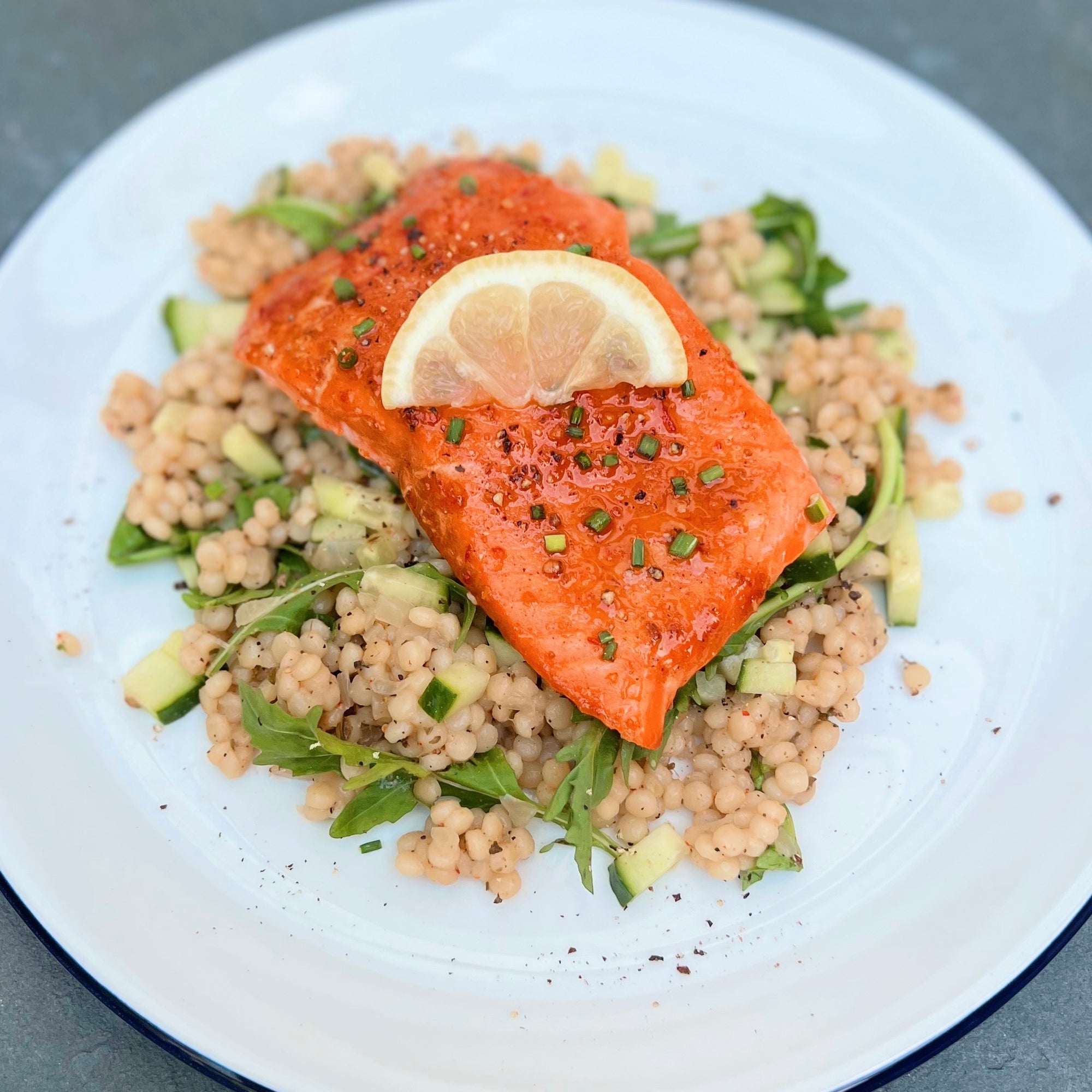 Honey Harissa Glazed Salmon with Kitchen & Market Israeli Couscous Pilaf and Arugula