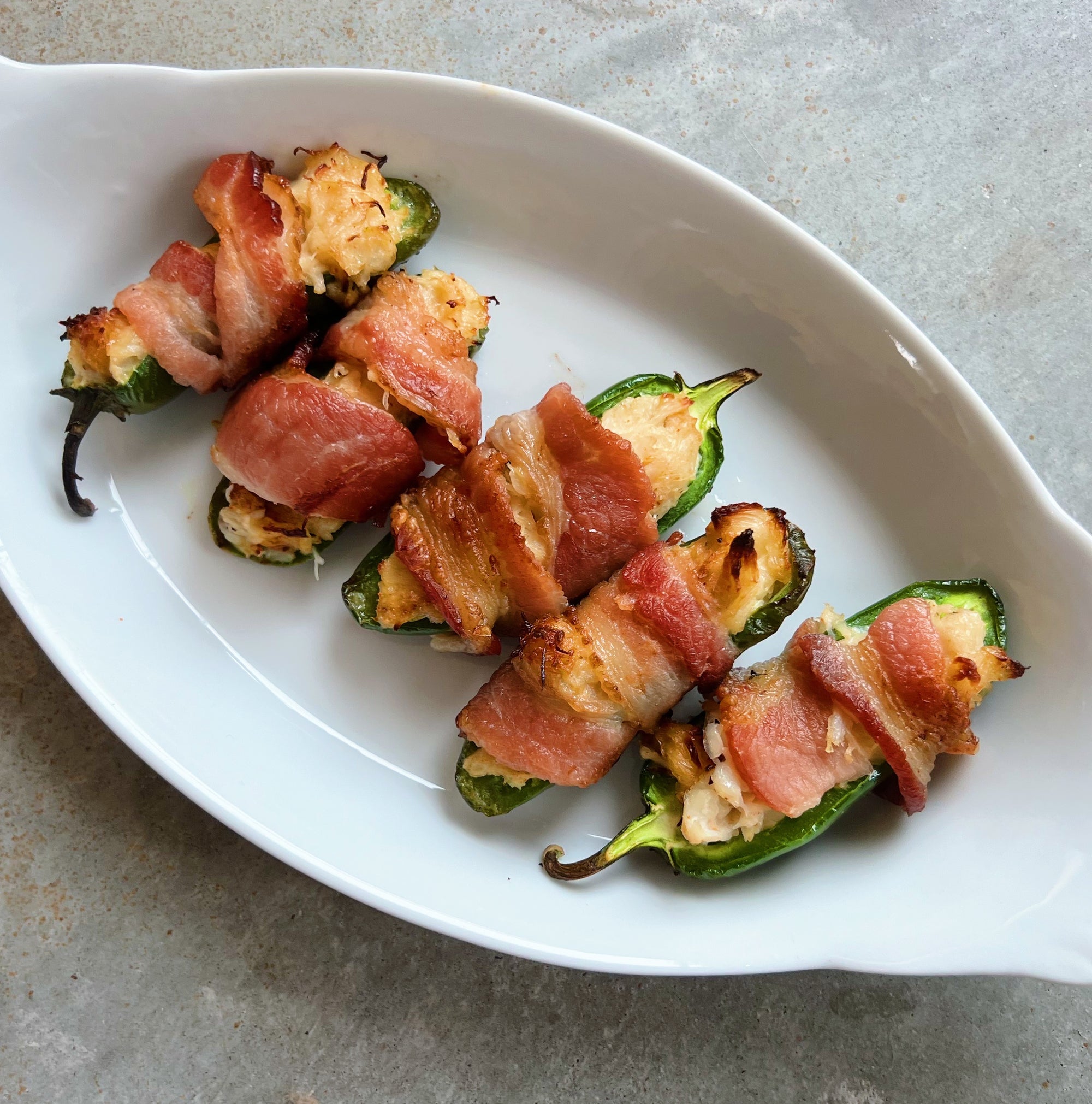 Crab Stuffed Jalapeno Poppers Wrapped in Bacon