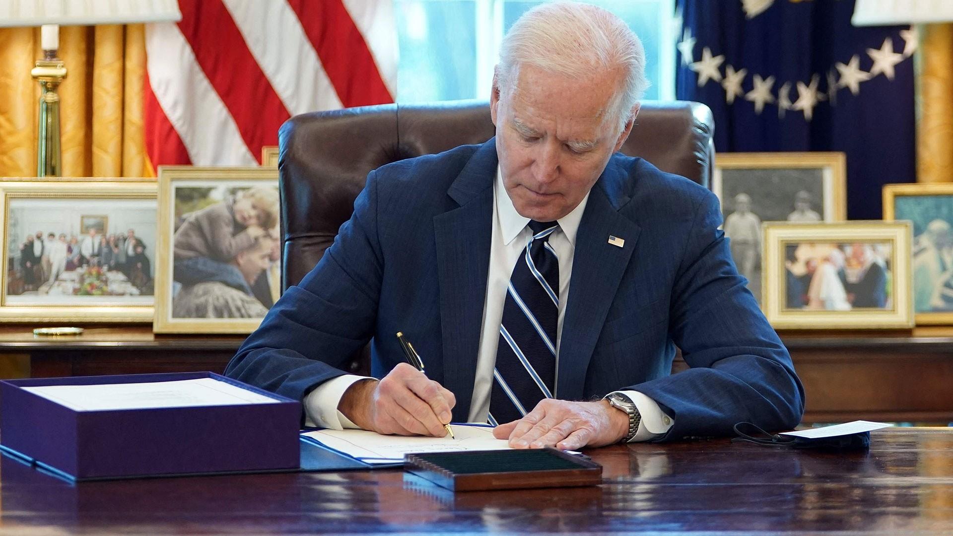 President Biden signing laws