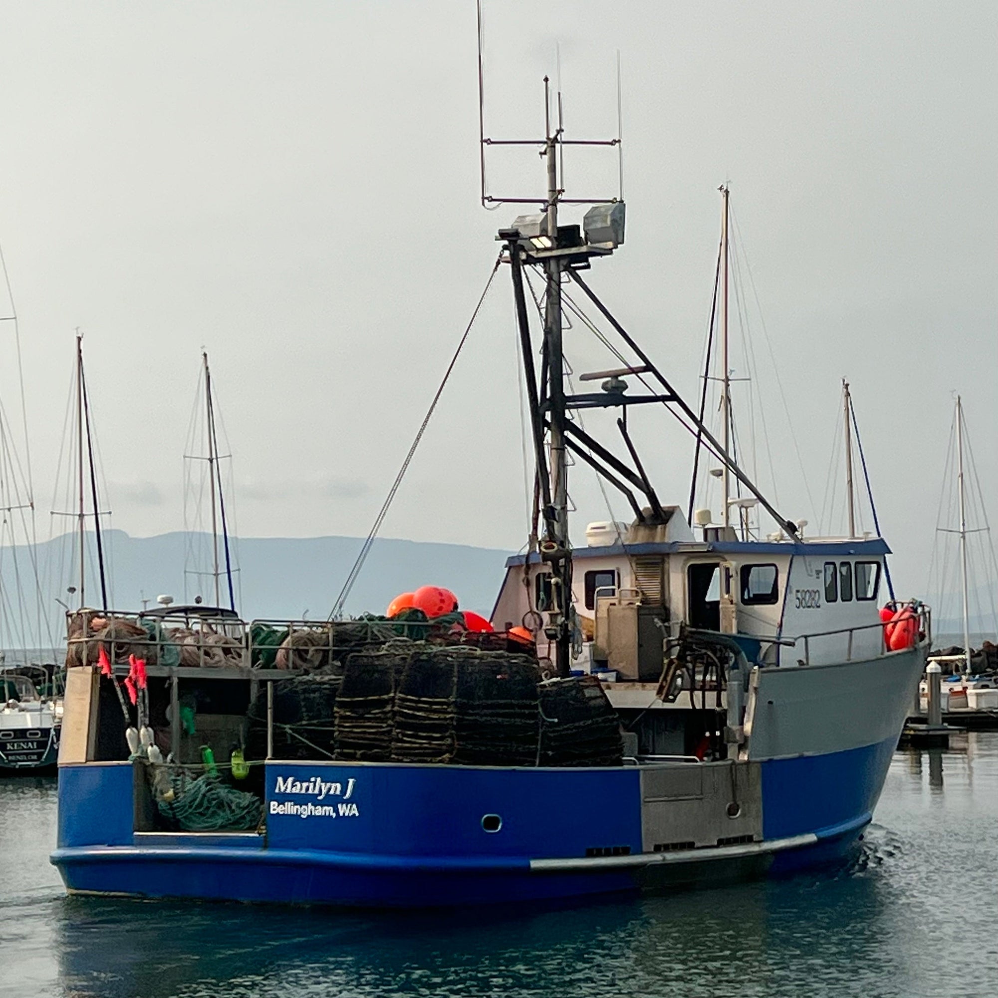 Fishing boat leaving harbor