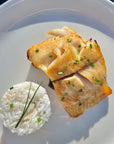 Nobu miso marinated black cod fish served with rice. Shipped frozen.