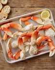 dungeness crab legs served with bread and lemon