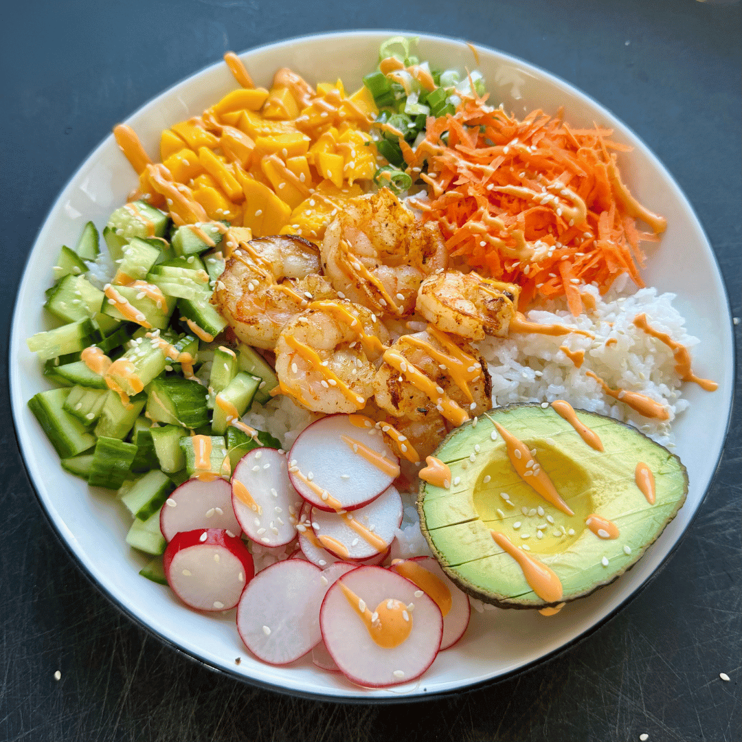 Square image of a Gulf shrimp power bowl with veggies and rice