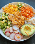 Square image of a Gulf shrimp power bowl with veggies and rice