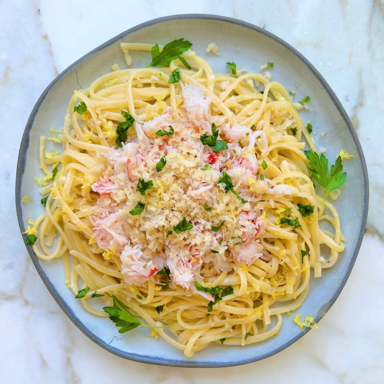 Snow crab meat on top of pasta