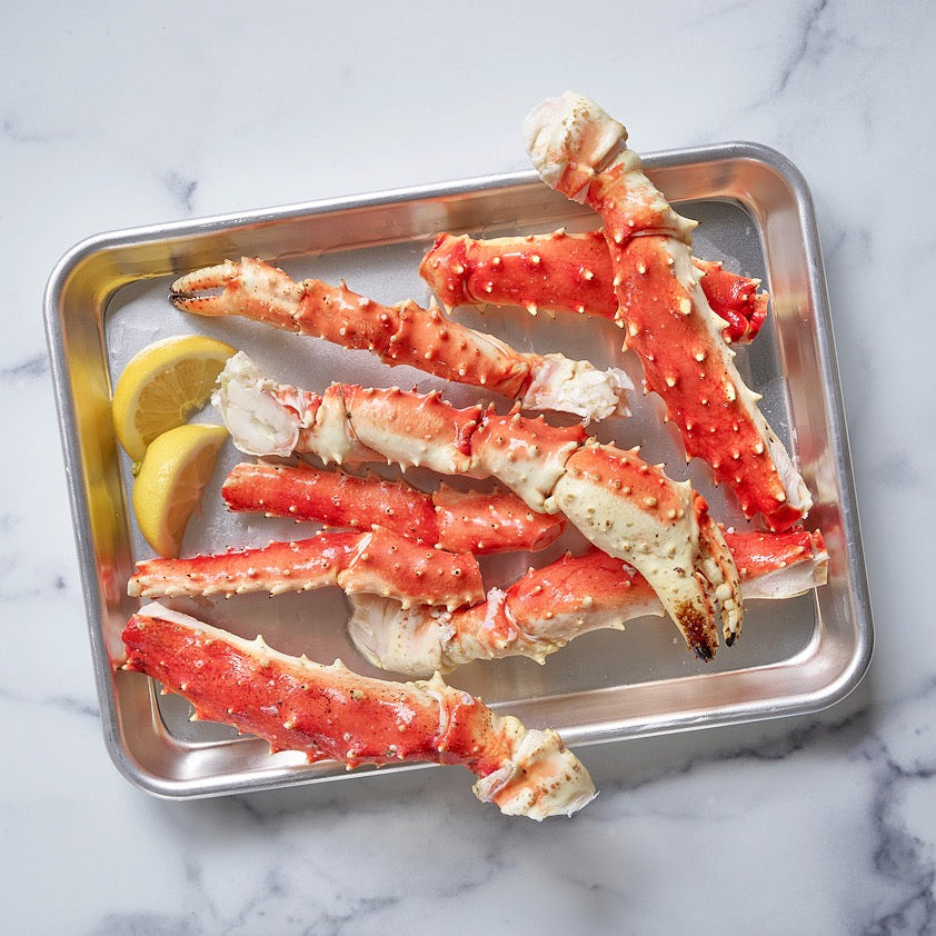 Alaskan red king crab legs served with lemon