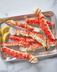 Alaskan red king crab legs served with lemon