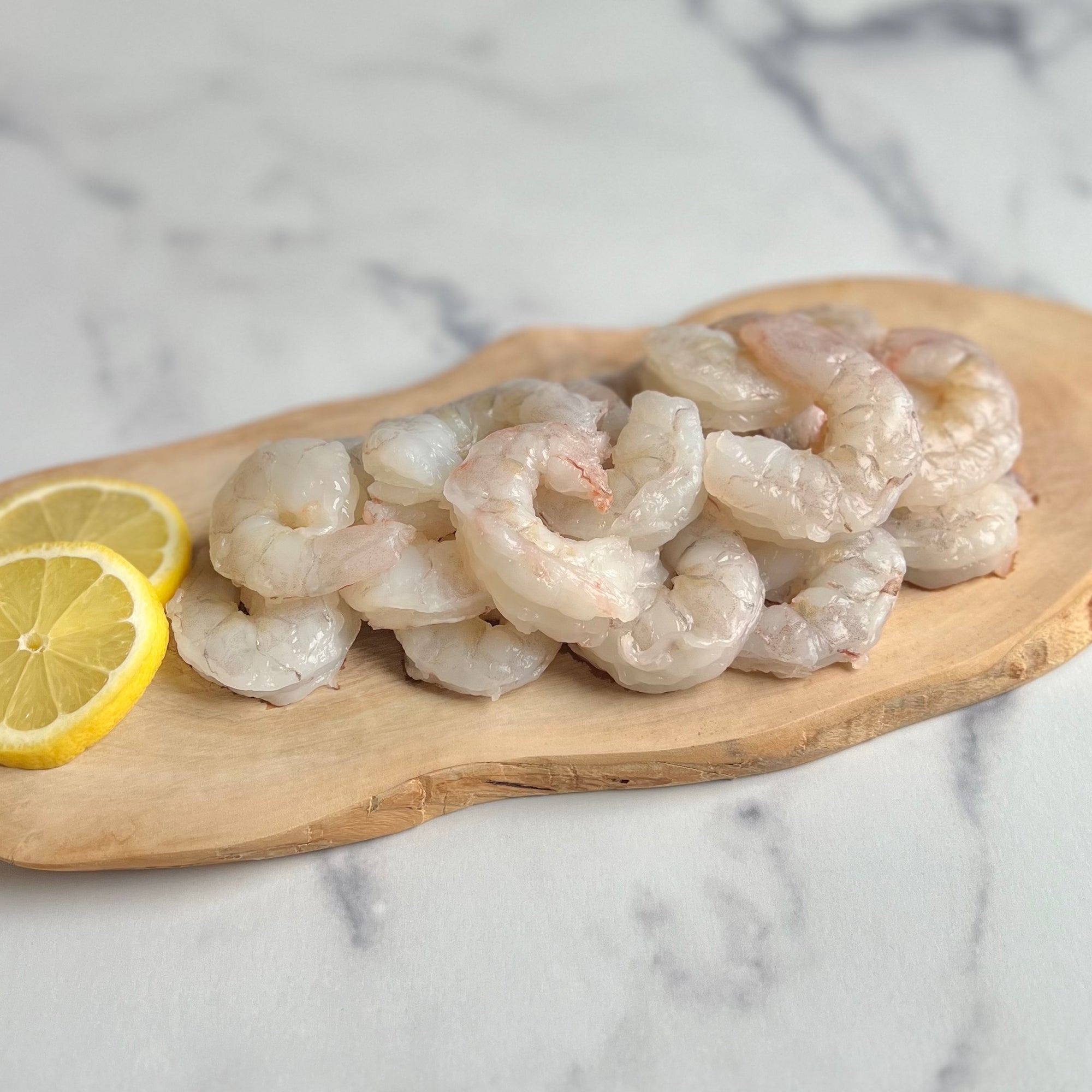 Image of wild Gulf shrimp on chopping board with lime