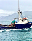 Fishing vessel in the Pacific Northwest US, where Premier Catch Dungeness crab legs are sustainably caught.