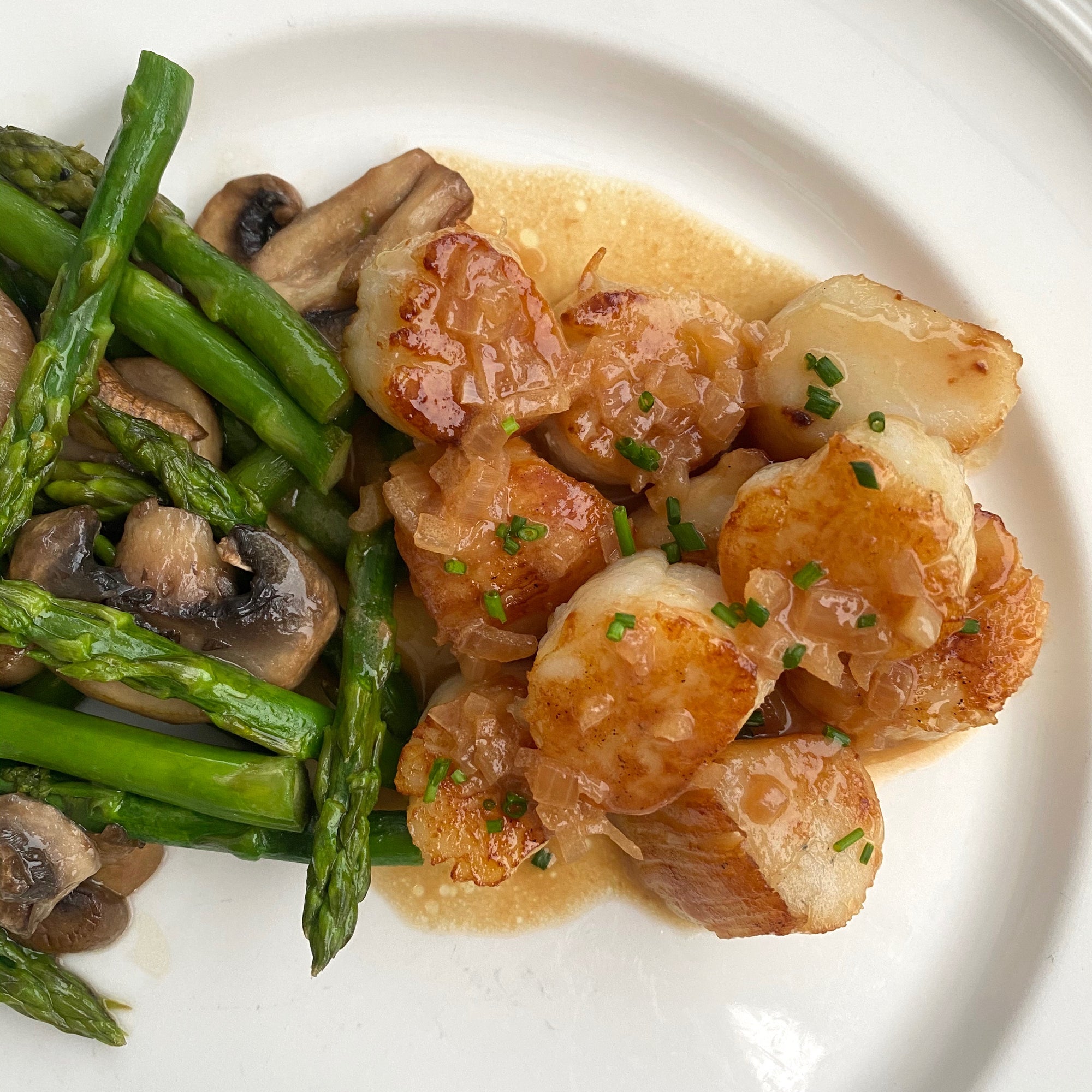 Weathervane scallop dish served on a plate with vegetables